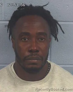 Mugshot of REGINALD TOUSSAINT booked in Etowah County, Alabama on June 15, 2026