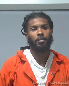 Mugshot of DEJION EVANS booked in Escambia County, Alabama on July 11, 2026