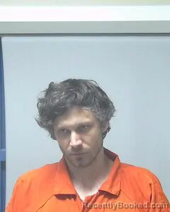 Mugshot of Travis Holland booked in Escambia County, Alabama on August 25, 2026