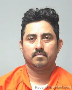 Mugshot of Algeber De La Cruz booked in Escambia County, Alabama on October 3, 2026