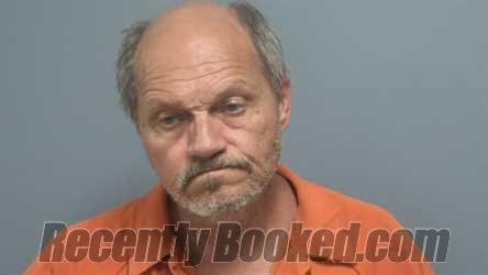 Mugshot of KELLY ERIC RAYNOR