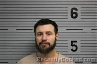 Mugshot of JUSTIN COFFEY booked in Jackson County, Alabama on May 6, 2026