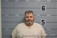 Mugshot of JASON HOLLAND booked in Jackson County, Alabama on July 7, 2026
