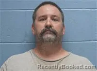 Mugshot of John William Davis booked in Lee County, Alabama on August 23, 2026