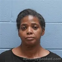 Mugshot of CRYSTAL GAIL TUCKER booked in Lee County, Alabama on March 24, 2026