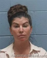 Mugshot of Gina Maria Carver booked in Lee County, Alabama on October 13, 2026