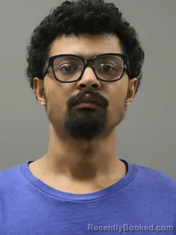 Mugshot of MALIK LAMONT RHODES booked in Limestone County, Alabama on April 14, 2026