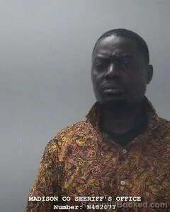 Mugshot of Justus O Odongo booked in Madison County, Alabama on August 8, 2026