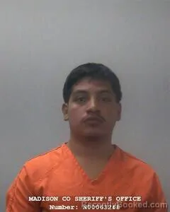 Mugshot of VICTOR M AGUILON MATIAS booked in Madison County, Alabama on June 21, 2026