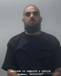 Mugshot of ANWAR BHAMANI booked in Madison County, Alabama on June 25, 2026