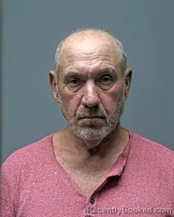 Mugshot of J ROBINSON booked in Russell County, Alabama on March 30, 2026