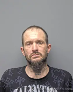 Mugshot of M CROFUTT booked in Russell County, Alabama on March 27, 2026