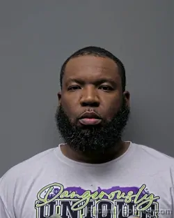 Mugshot of J BURTON booked in Russell County, Alabama on March 20, 2026