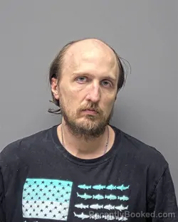 Mugshot of J PFANNSCHMIDT booked in Russell County, Alabama on March 30, 2026