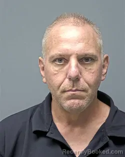 Mugshot of J COTTOM booked in Russell County, Alabama on May 12, 2026