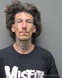 Mugshot of A CSWELL CASWELL booked in Russell County, Alabama on March 31, 2026