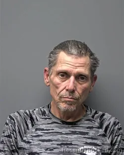 Mugshot of R Galvis booked in Russell County, Alabama on August 18, 2026