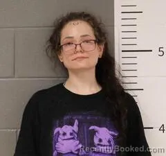 Mugshot of JUSTINE DELATOUR booked in St Clair County, Alabama on March 10, 2026