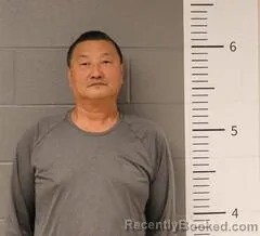 Mugshot of SUN DAJUN booked in St Clair County, Alabama on March 31, 2026