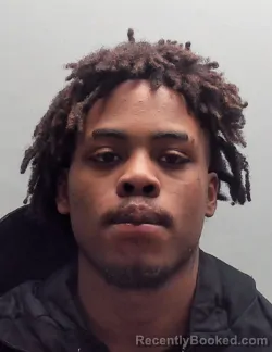 Mugshot of JOHNTAVION LAUSHAD TAYLOR