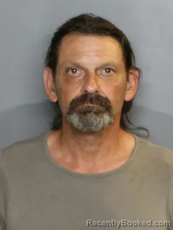 Mugshot of DENNIS ERIC MOORE booked in Charlotte County, Florida on April 8, 2026