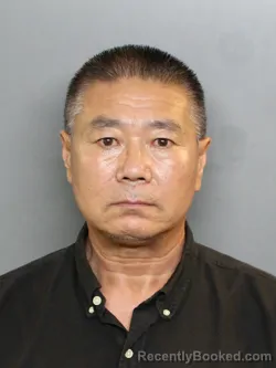 Mugshot of XIAOFENG WANG booked in Charlotte County, Florida on July 9, 2026