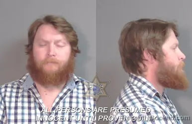 Mugshot of Justin Taylor Golden booked in Caddo County, Louisiana on March 20, 2026