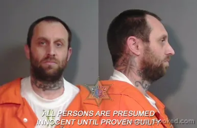 Mugshot of Johnathan Michael Rhoades booked in Caddo County, Louisiana on April 26, 2026