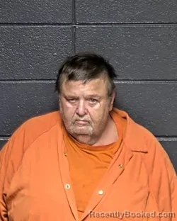 Mugshot of MICHAEL L REYNOLDS