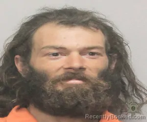 Mugshot of CHEVY JAMES MENARD booked in Lafayette County, Louisiana on March 11, 2026