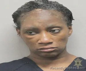 Mugshot of CRYSTAL RENEE RUBIN booked in Lafayette County, Louisiana on March 13, 2026