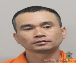 Mugshot of KHOA H BACH booked in Lafayette County, Louisiana on March 22, 2026