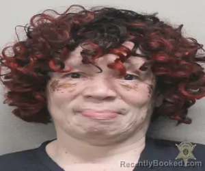 Mugshot of GLORIA VICTORIA BABINEAUX booked in Lafayette County, Louisiana on March 30, 2026