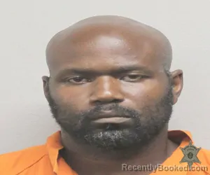 Mugshot of SHEM DENZIL CHARLES booked in Lafayette County, Louisiana on March 31, 2026