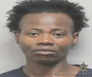 Mugshot of BRITTANY LASHAE WOODS booked in Lafayette County, Louisiana on March 31, 2026