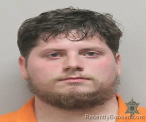 Mugshot of JORDAN MICHAEL ROME booked in Lafayette County, Louisiana on April 3, 2026