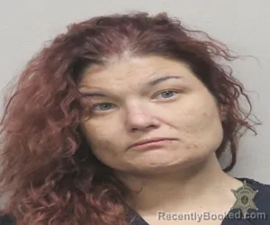 Mugshot of AMBER HAMMON MILLER booked in Lafayette County, Louisiana on April 4, 2026