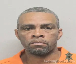 Mugshot of JONATHAN CLEMENT ALEXANDER booked in Lafayette County, Louisiana on April 8, 2026