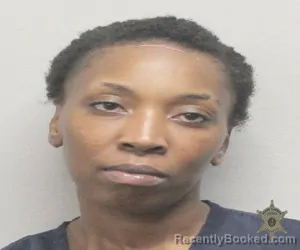 Mugshot of ALEXANDRIA TOMLINSON booked in Lafayette County, Louisiana on April 24, 2026