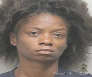 Mugshot of LUCHETTA RAVIN FLORES booked in Lafayette County, Louisiana on May 4, 2026