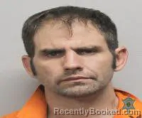 Mugshot of Joshua James Menard booked in Lafayette County, Louisiana on September 29, 2026