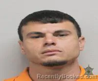 Mugshot of Jonathan Simar booked in Lafayette County, Louisiana on October 23, 2026