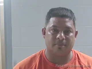 Mugshot of Naun Francisco Munguia Macias booked in Livingston County, Louisiana on August 13, 2026