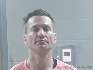 Mugshot of Justin Anthony Bourgeois booked in Livingston County, Louisiana on August 11, 2026