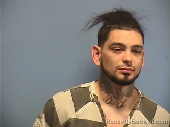 Mugshot of JUSTIN BREWER