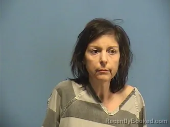 Mugshot of MELINA CARCABASIS booked in St Tammany County, Louisiana on March 27, 2026