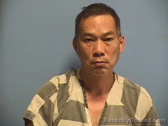 Mugshot of HUNG TRINH booked in St Tammany County, Louisiana on March 29, 2026