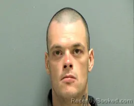 Mugshot of JESSE LOGAN RHINEHARDT