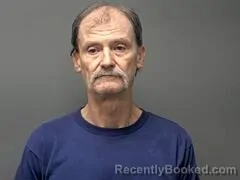 Mugshot of DOYLE G GEORGE booked in Baxter County, Arkansas on April 15, 2026