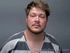 Mugshot of TREVOR J OLSON booked in Baxter County, Arkansas on April 27, 2026